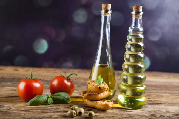 Fresh olive oil ,baguettes, tomatoes — Stock Photo, Image