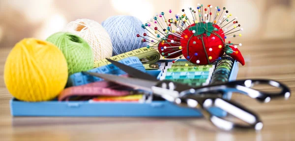 Sewing with color threads, meter and scissors — Stock Photo, Image