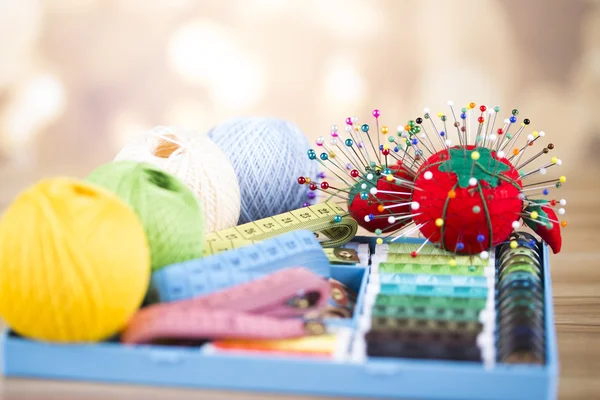 Sewing with color threads, meter and scissors — Stock Photo, Image