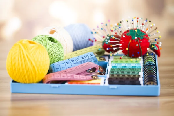 Sewing with color threads, meter and scissors — Stock Photo, Image