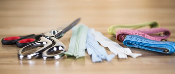 Sewing with color threads, meter and scissors — Stock Photo, Image