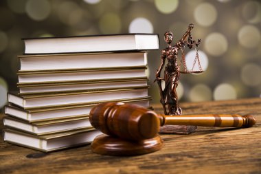 Golden scales of justice, books, Statue of Lady Justice. Owl and paragraph