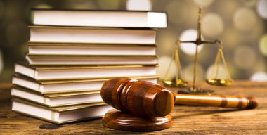 Golden scales of justice, books, Statue of Lady Justice. Owl and paragraph