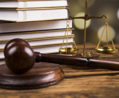 Golden scales of justice, books, Statue of Lady Justice. Owl and paragraph