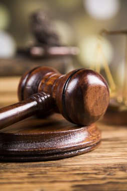 Golden scales of justice, books, Statue of Lady Justice. Owl and paragraph