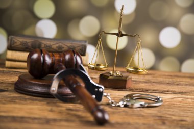 Golden scales of justice, books, Statue of Lady Justice. Owl and paragraph