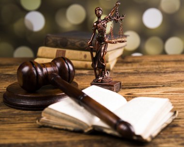 Golden scales of justice, books, Statue of Lady Justice. Owl and paragraph