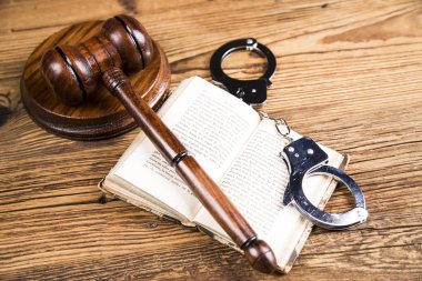 Golden scales of justice, books, Statue of Lady Justice. Owl and paragraph
