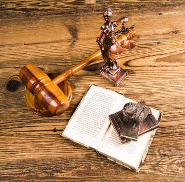 Golden scales of justice, books, Statue of Lady Justice. Owl and paragraph