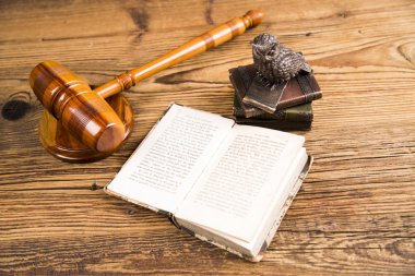 Golden scales of justice, books, Statue of Lady Justice. Owl and paragraph