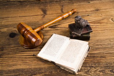 Golden scales of justice, books, Statue of Lady Justice. Owl and paragraph