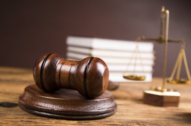 Golden scales of justice, books, Statue of Lady Justice. Owl and paragraph