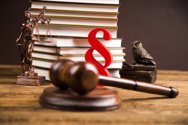 Golden scales of justice, books, Statue of Lady Justice. Owl and paragraph