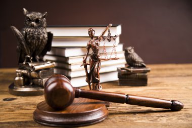 Golden scales of justice, books, Statue of Lady Justice. Owl and paragraph