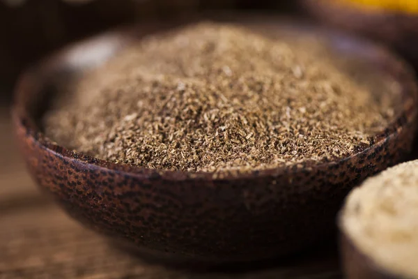 Spices and herbs in wooden bowls — Stock Photo, Image