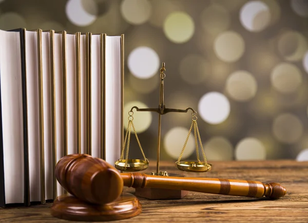 Golden scales of justice, books, Statue of Lady Justice. Owl and paragraph