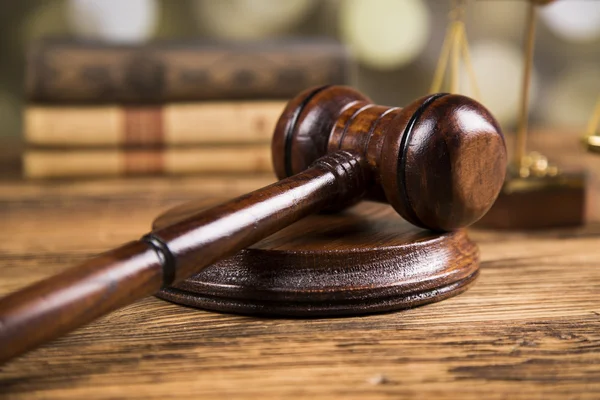 Golden scales of justice, books, Statue of Lady Justice. Owl and paragraph