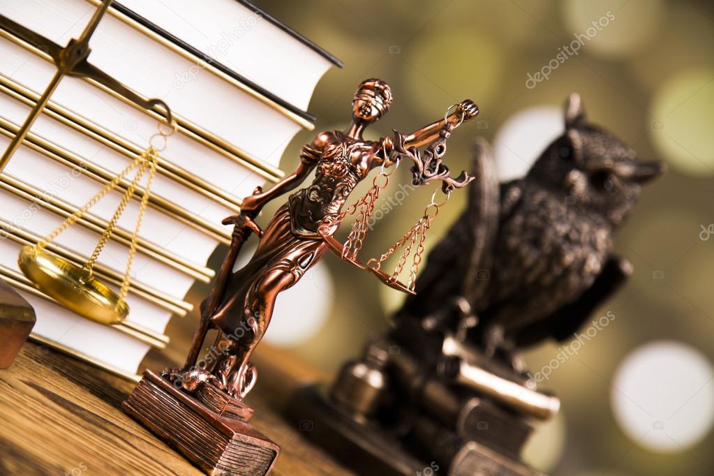 Golden scales of justice, books, Statue of Lady Justice. Owl and paragraph