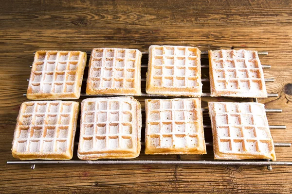 Waffles with whipped cream and raspberries and cranberries,  Waffles with icing sugar