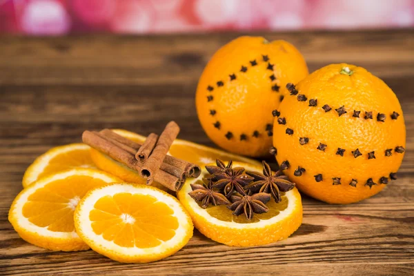 Christmas tree with cones, oranges with cinnamon and aniseed — Stock Photo, Image