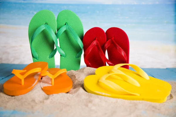 Vacation, sand, colorful molds for the sandbox, flip-flops colorful shells, the belt for swimming