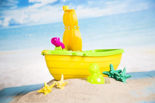 Vacation, sand, colorful molds for the sandbox, flip-flops colorful shells, the belt for swimming