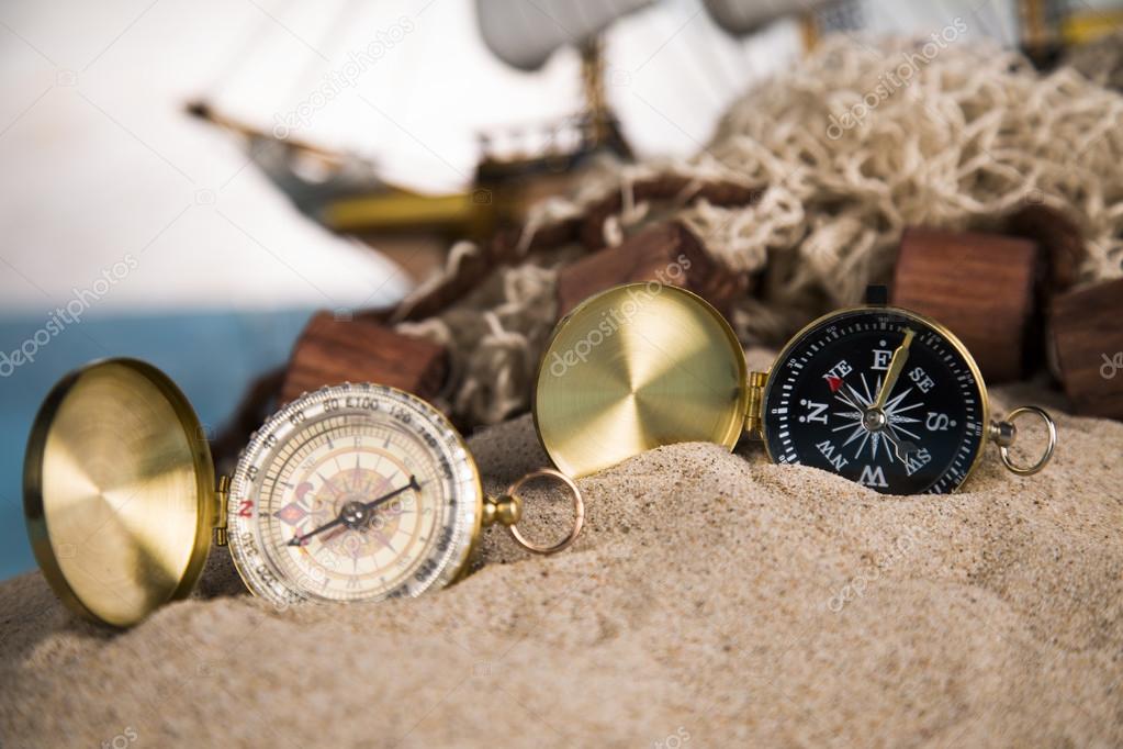 Holiday by the sea, fishing, nets, shells, magnifying glass and binoculars, compass