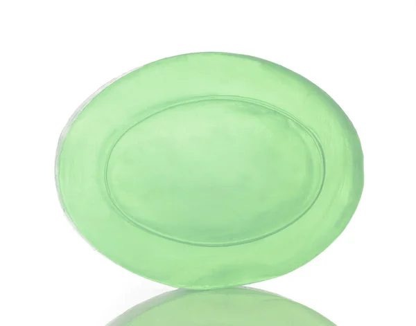 Barra de jabón verde transparente en blanco — Foto de Stock