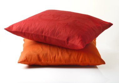 Red and Yellow Pillows On White Background clipart