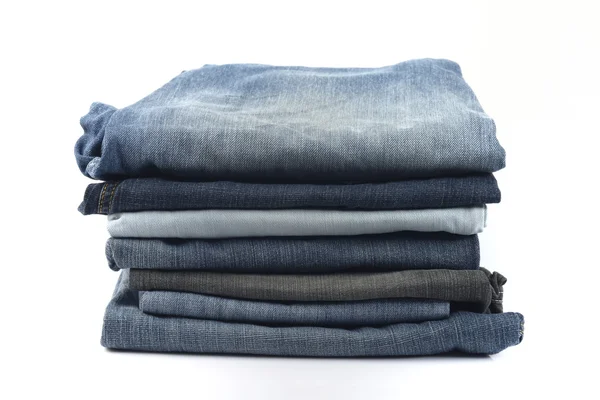 Stack blå och svarta jeans — Stockfoto