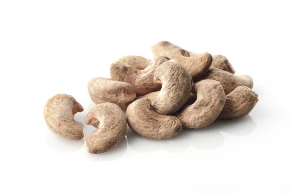 Heap Of Cashews With Skin on White Background Shot in Studio — Stock Photo, Image