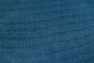 Background of blue wool fabric in a small cage for autumn and winter wardrobe. Horizontal orientation