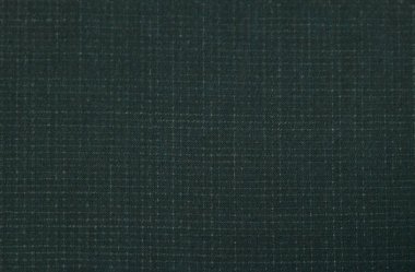 Background of dark textured purple wool fabric in a small cage for sewing autumn and winter clothing. Horizontal orientation
