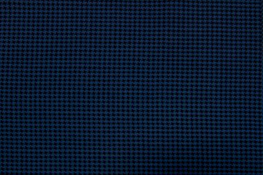 A close-up of the background made of blue-black wool textured fabric is suitable for autumn and winter wardrobe. Horizontal orientation