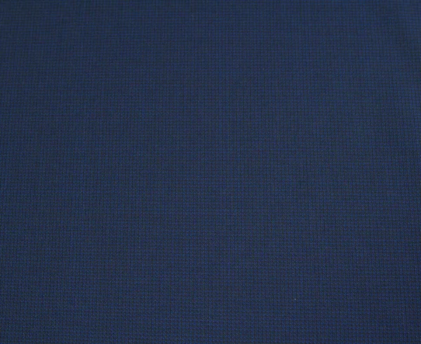 Textured background made of dark blue wool fabric for autumn and winter wardrobe. Horizontal orientation — Stok fotoğraf