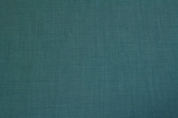 背景为深绿色的纹理斜纹棉布，用于秋季和冬季衣橱。横向方向： — 图库照片