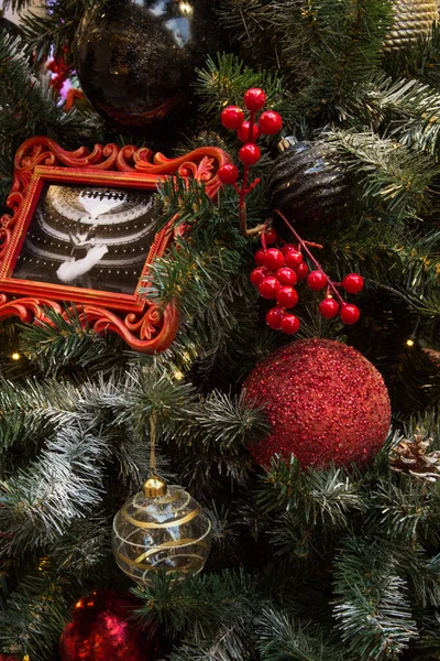 Close-up of Christmas decorations on the tree. Vertical orientation — Fotografia de Stock