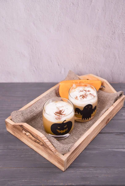 Two Glass Glasses Halloween Themed Drawings Pumpkin Latte Wooden Tray — Stock Photo, Image