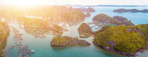 Aerial view of floating fishing village and rock island in Cat Ba island from above. Lan Ha bay. Hai phong, Vietnam.It is a touring floating fishing village of UNESCO World Heritage Site in Vietnam.