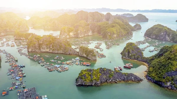 Aerial view of floating fishing village and rock island in Cat Ba island from above. Lan Ha bay. Hai phong, Vietnam.It is a touring floating fishing village of UNESCO World Heritage Site in Vietnam.