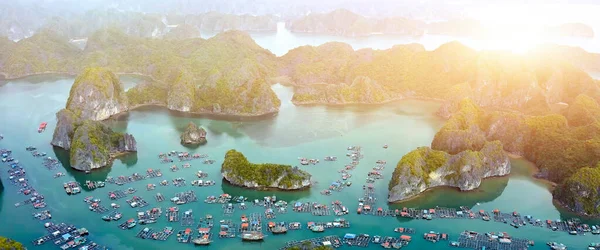 Aerial view of floating fishing village and rock island in Cat Ba island from above. Lan Ha bay. Hai phong, Vietnam.It is a touring floating fishing village of UNESCO World Heritage Site in Vietnam.