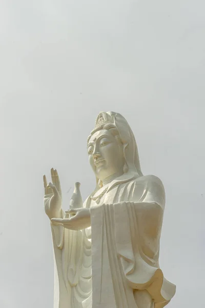 big statue of guanyin bodhisattva on mount in Ho Quoc pagoda (Vietnamese name is Truc Lam Thien Vien) with , Phu Quoc island, Vietnam