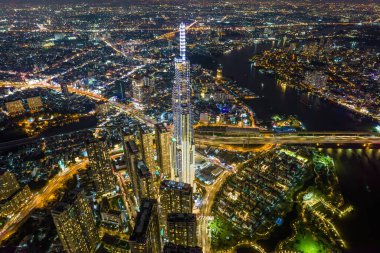 Aerial panoramic cityscape view of Ho Chi Minh city and the River Saigon, beauty skyscrapers along river light smooth down urban development. Financial and business centers in developed Vietnam