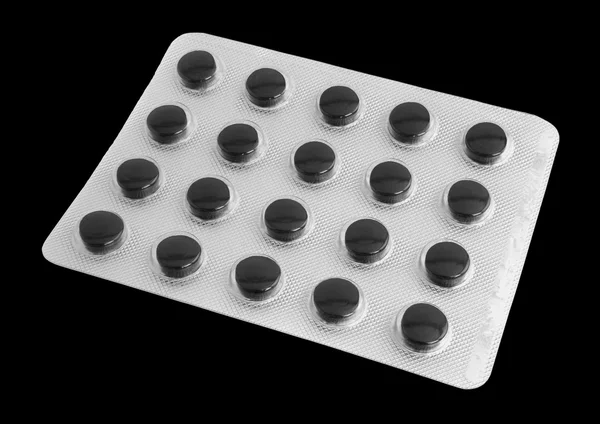 Medicine. Black tablets of activated coal. Full blister pills. I — Stock Photo, Image