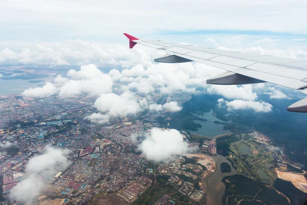 Clouds and sky as seen through window of an aircraft — Stock Photo, Image