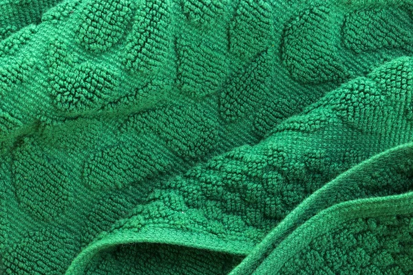 背景的绿色质地柔软的浴巾折叠 — 图库照片