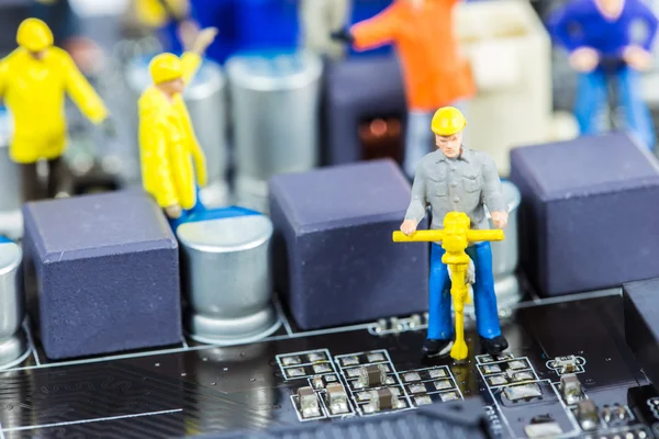 Team of engineers repairing circuit mother board