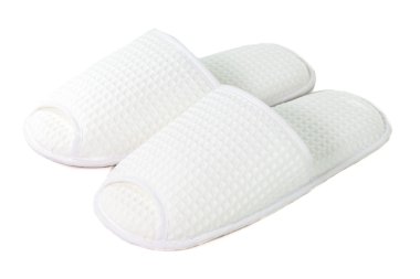 Beyaz bir arka planda beyaz terlik bir çift.