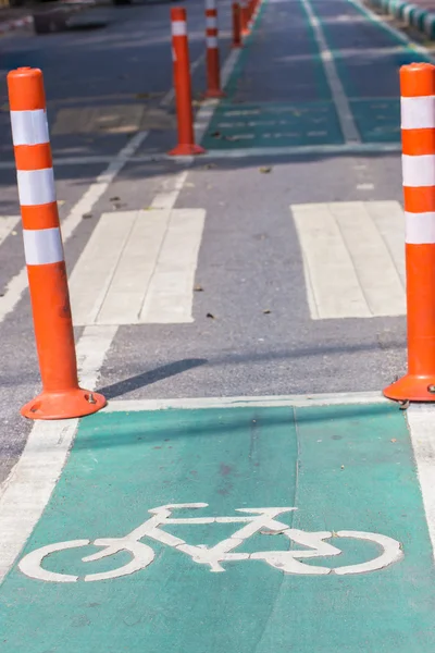 Bike lane asphalt texture and Bicycle road sign — Stock Photo, Image