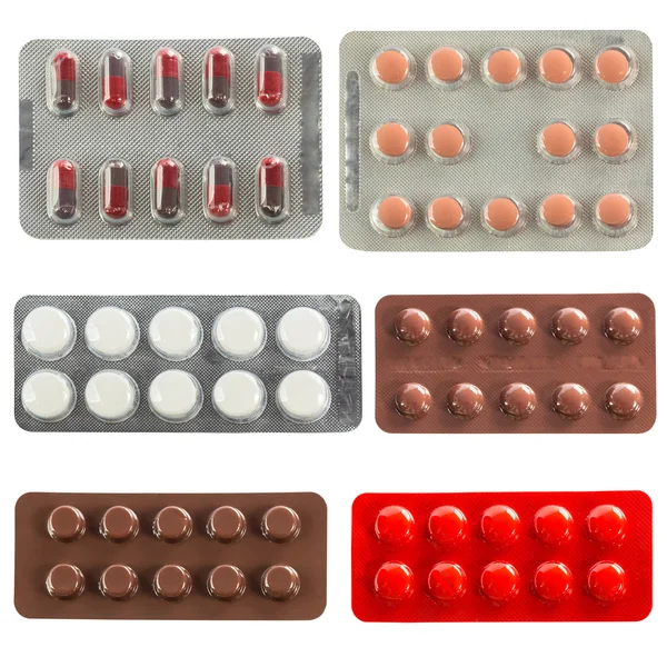 Сбор таблеток в прозрачных пузырьковых упаковках — стоковое фото